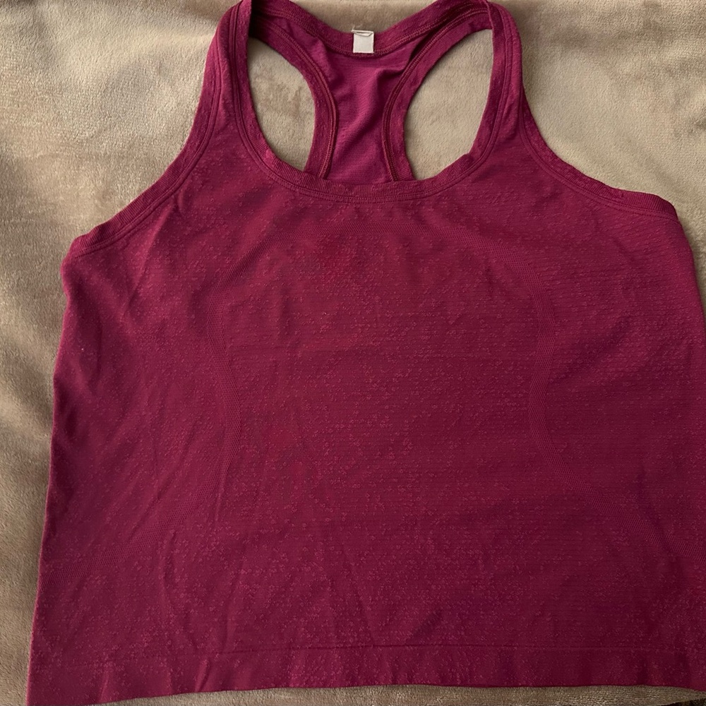 Lululemon Swiftly Tech Racerback Tank Top-waist length, color raspberry. Size 8